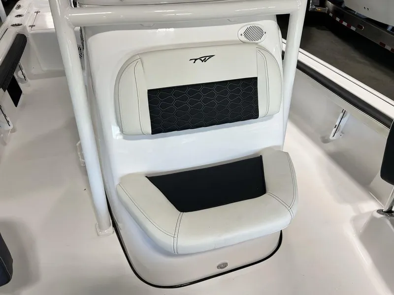 Slide: The Image of 2025 Tidewater 2300 Carolina Bay boat seat with white and black upholstery. - 13
