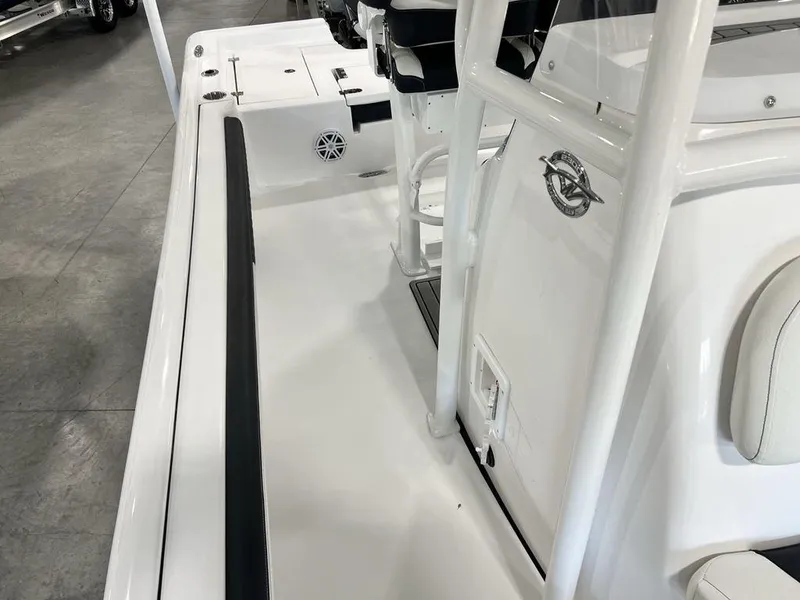 Slide: The Image of 2025 Tidewater 2300 Carolina Bay boat interior, featuring sleek white design and modern seating. - 14
