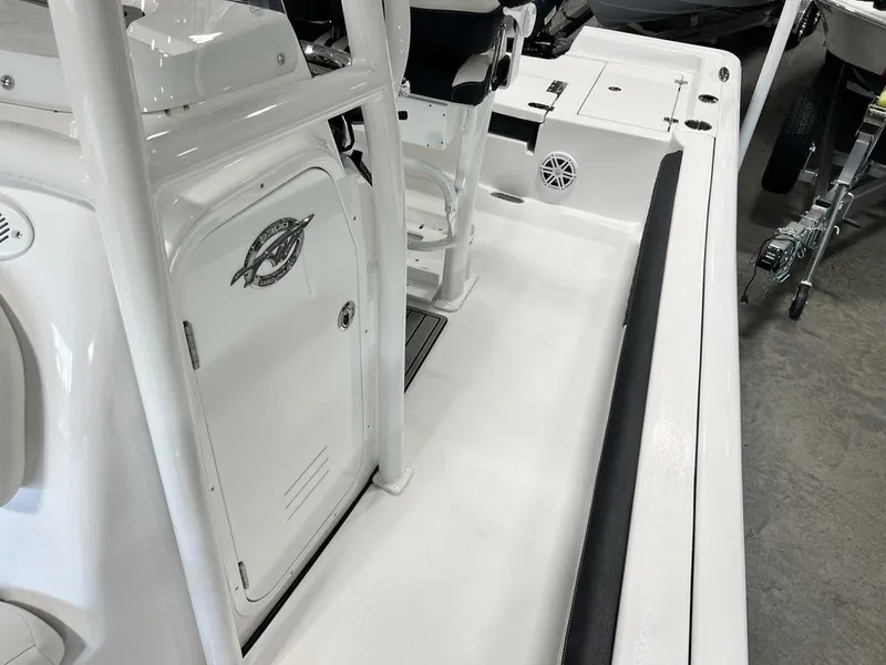 Slide: The Image of 2025 Tidewater 2300 Carolina Bay boat interior with seating and storage compartments. - 15