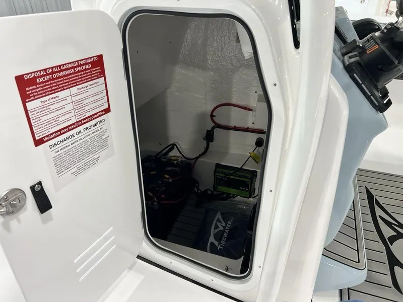 Slide: The Image of Open storage compartment in 2025 Tidewater 2300 Carolina Bay boat. - 16
