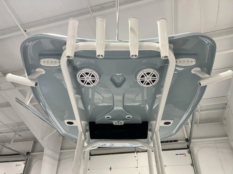 Slide: The Image of 2025 Tidewater 2300 Carolina Bay boat T-top with rod holders and speakers. - 25