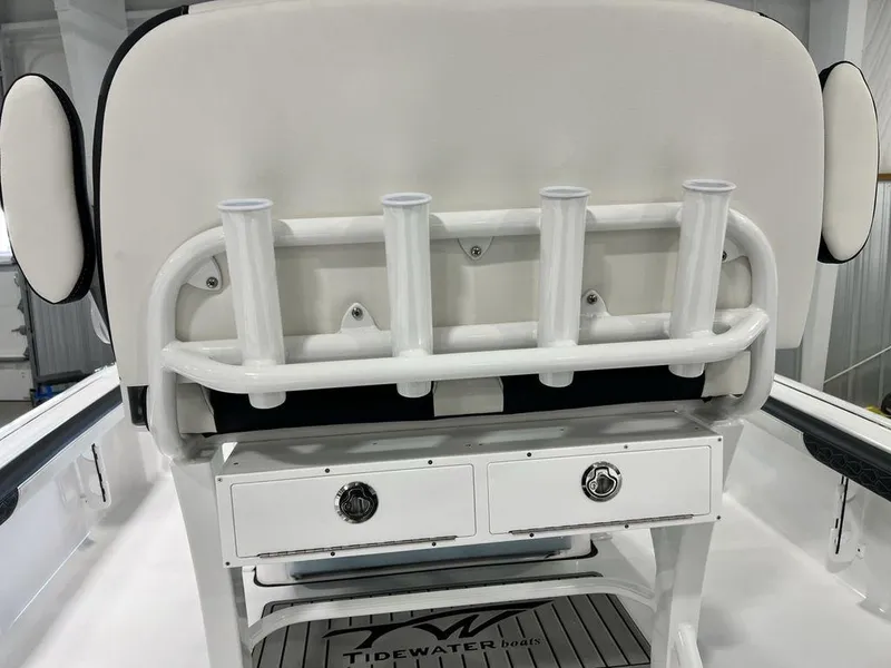 Slide: The Image of 2025 Tidewater 2300 Carolina Bay boat with rod holders and storage drawers. - 26
