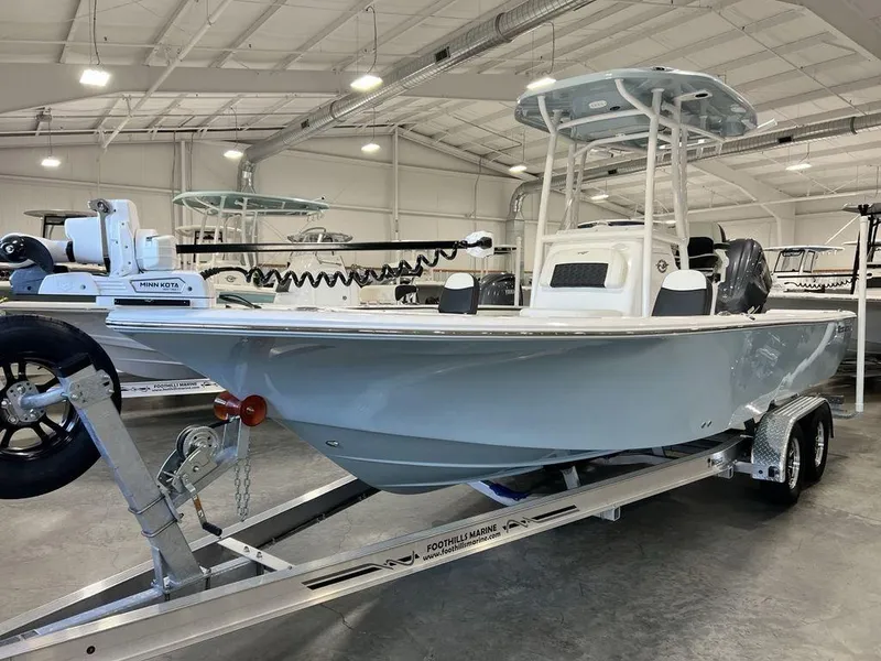 Slide: The Image of 2025 Tidewater 2300 Carolina Bay boat on trailer in showroom. - 3