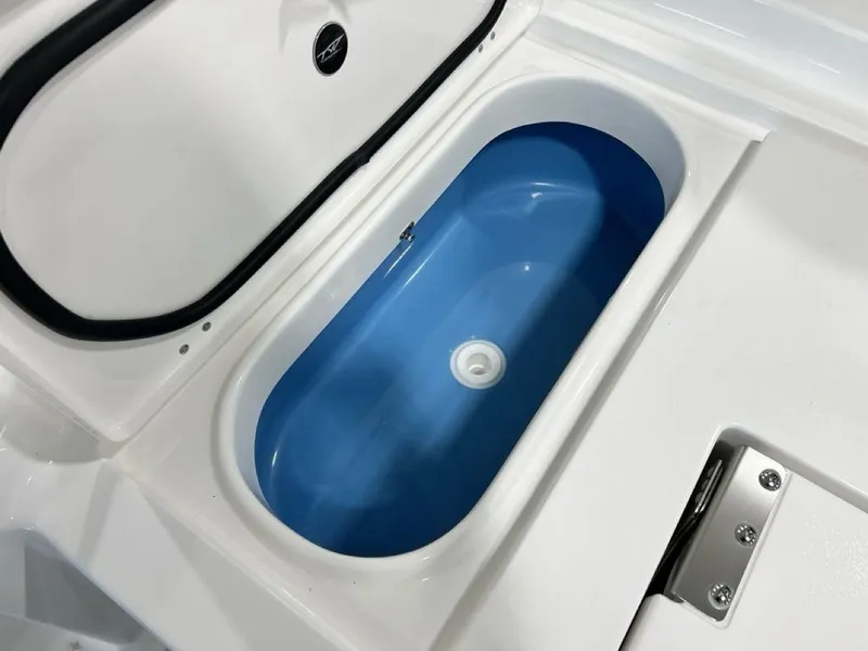 Slide: The Image of 2025 Tidewater 2300 Carolina Bay boat livewell with blue interior. - 30