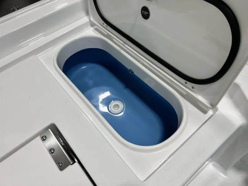 Slide: The Image of 2025 Tidewater 2300 Carolina Bay boat livewell with open lid. - 32
