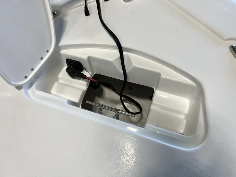 Slide: The Image of 2025 Tidewater 2300 Carolina Bay boat storage compartment with wiring. - 5