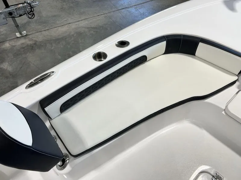Slide: The Image of 2025 Tidewater 2300 Carolina Bay boat interior seating with cup holders. - 6