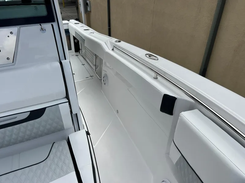 Slide: The Image of 2025 Blackfin 272 CC boat interior with sleek white design and modern features. - 10