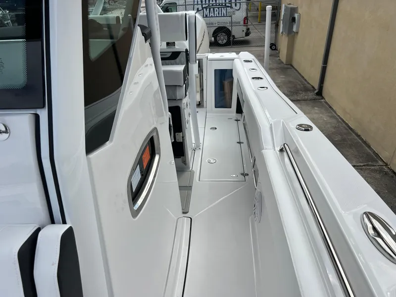 Slide: The Image of 2025 Blackfin 272 CC boat deck, sleek design, white finish, modern features. - 11