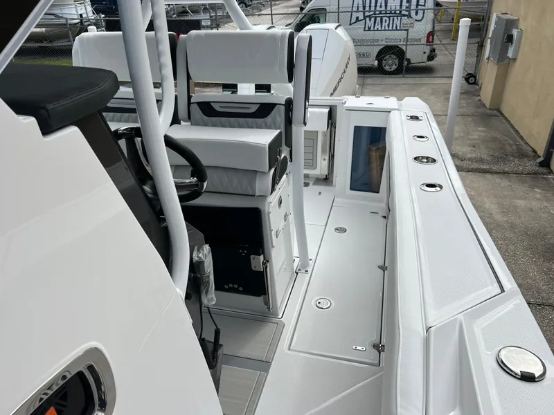 Slide: The Image of 2025 Blackfin 272 CC boat interior with seating and steering wheel. - 12