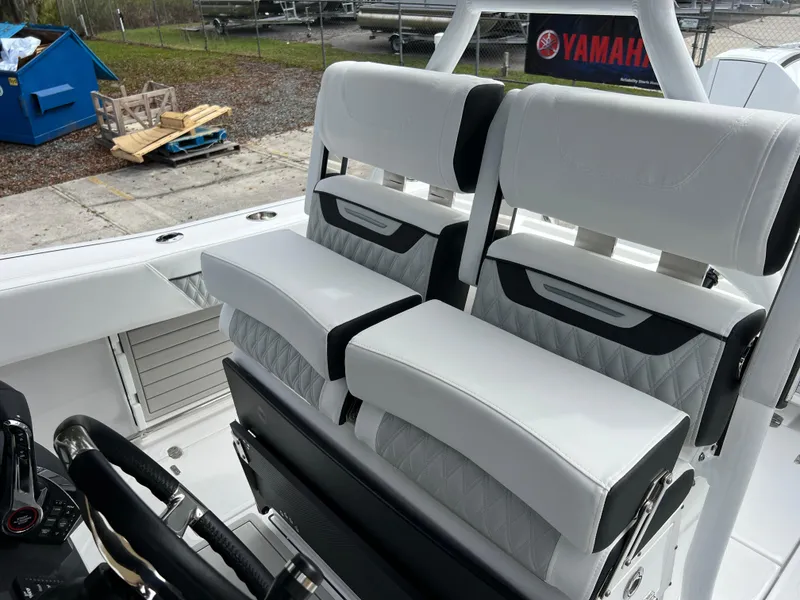 Slide: The Image of 2025 Blackfin 272 CC boat seats with white and black upholstery. - 13