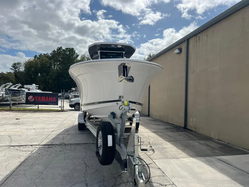 Slide: The Image of 2025 Blackfin 272 CC boat on trailer, parked outdoors under cloudy sky. - 20