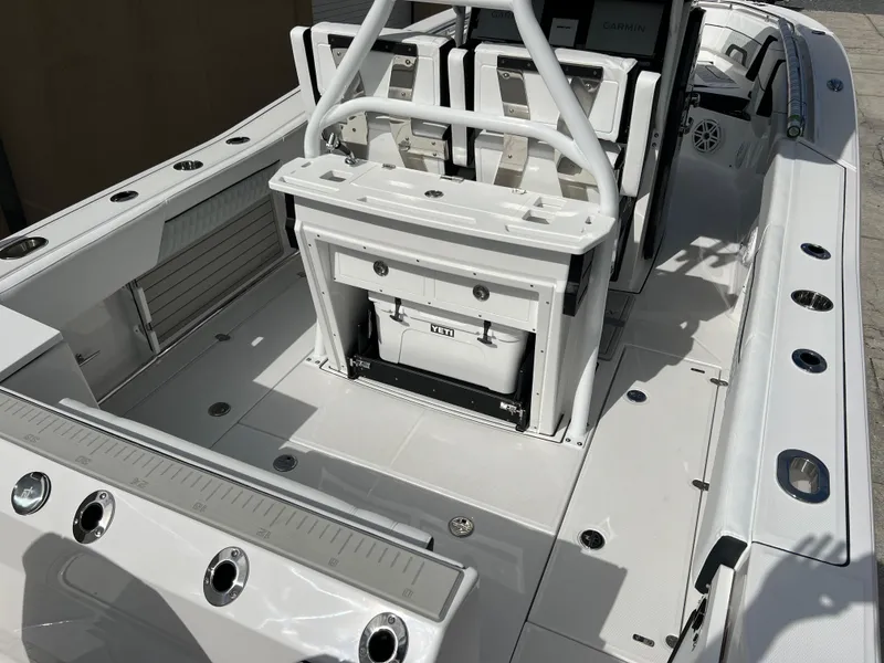 Slide: The Image of 2025 Blackfin 272 CC boat interior with seating and storage features. - 32