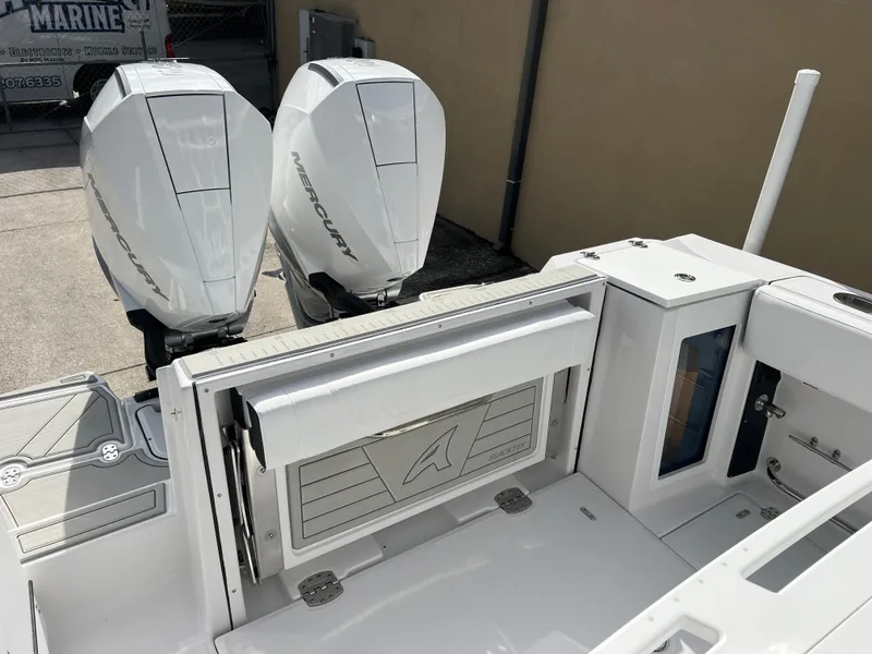 Slide: The Image of 2025 Blackfin 272 CC boat with dual Mercury outboard engines, rear deck view. - 34