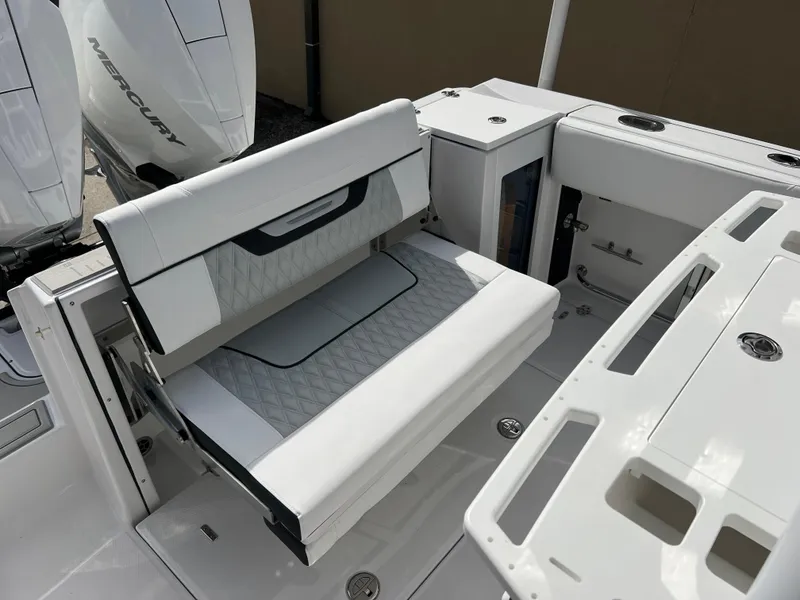 Slide: The Image of 2025 Blackfin 272 CC boat interior with white seating and storage compartments. - 35