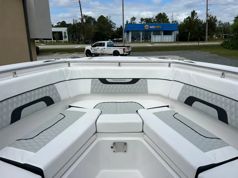 Slide: The Image of 2025 Blackfin 272 CC boat interior with white cushioned seating. - 4
