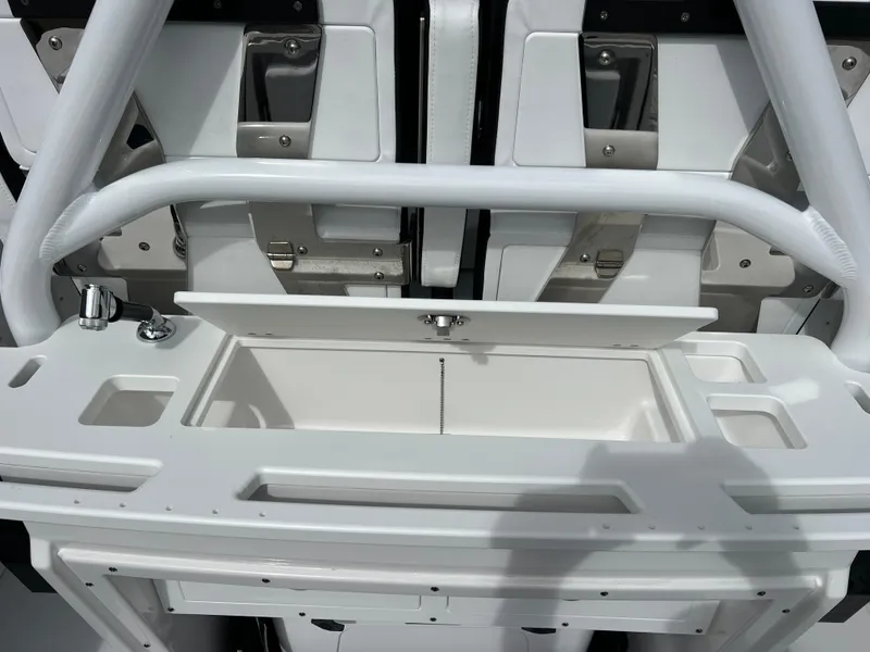 Slide: The Image of 2025 Blackfin 272 CC boat interior with storage compartment and stainless steel fixtures. - 44