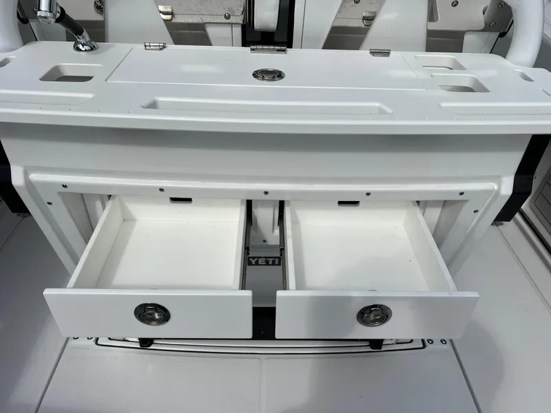 Slide: The Image of 2025 Blackfin 272 CC boat with open storage drawers and sleek design. - 45