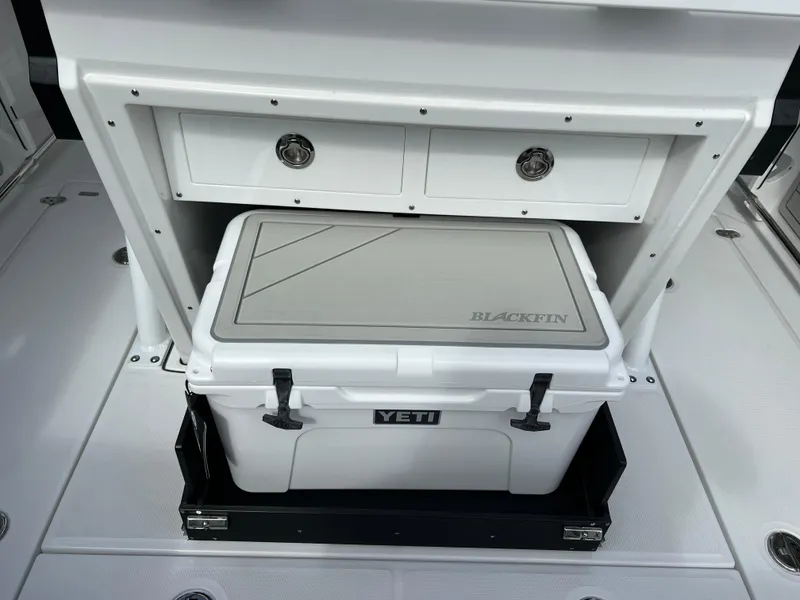 Slide: The Image of 2025 Blackfin 272 CC boat with Yeti cooler storage compartment. - 46