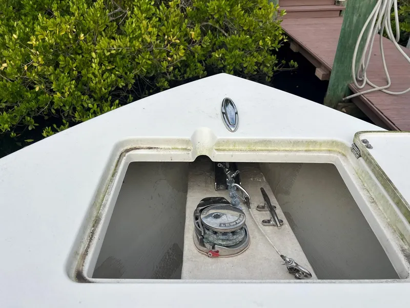 Slide: The Image of Anchor storage compartment on 2015 Cobia 237 Center Console boat. - 6