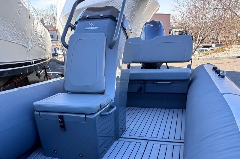 Slide: The Image of 2025 Highfield Classic 460 boat interior with seating and console. - 2