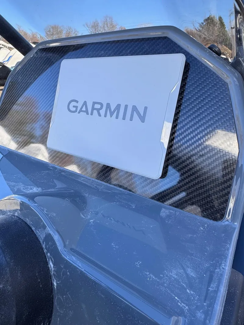 Slide: The Image of 2025 Highfield Classic 460 boat dashboard with Garmin navigation system. - 6