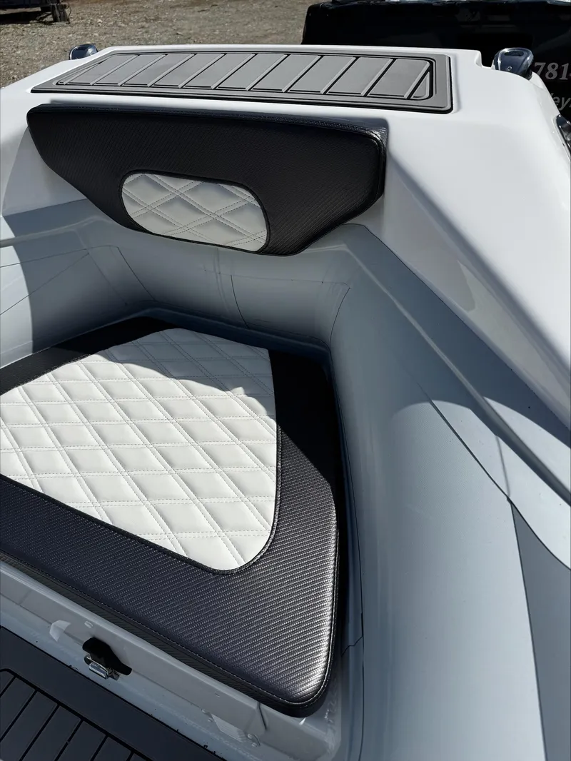 Slide: The Image of 2025 Highfield Sport 420 boat with diamond-stitched seating and sleek design. - 14