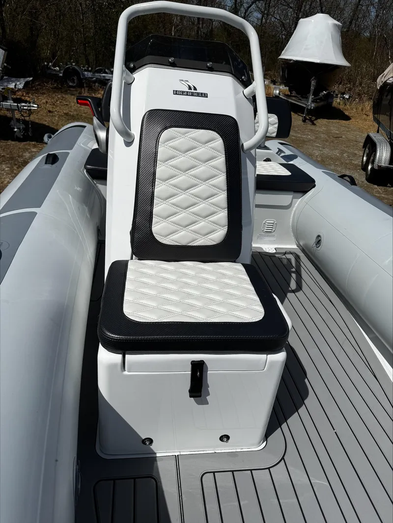 Slide: The Image of 2025 Highfield Sport 420 boat with cushioned seating and sleek design. - 16