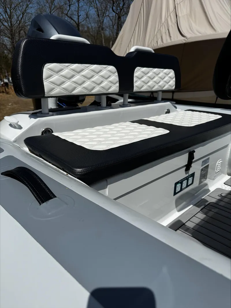 Slide: The Image of 2025 Highfield Sport 420 boat with quilted seating, outdoor setting. - 17