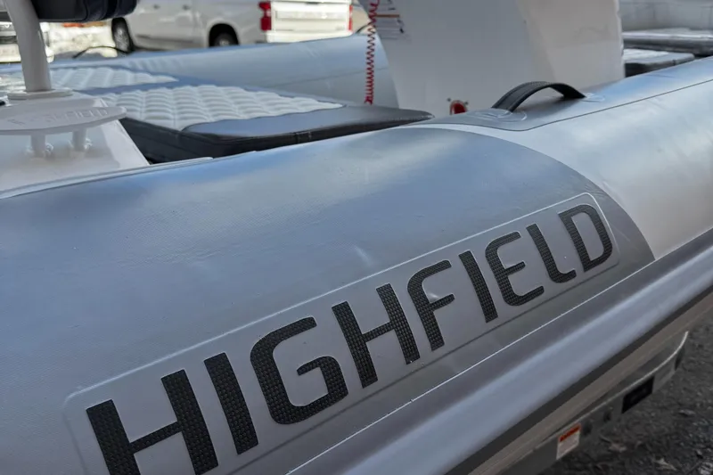 Slide: The Image of 2025 Highfield Sport 420 boat, close-up of branding and seating area. - 6