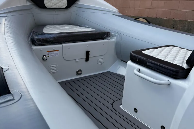 Slide: The Image of 2025 Highfield Sport 420 boat interior with cushioned seating and sleek design. - 8