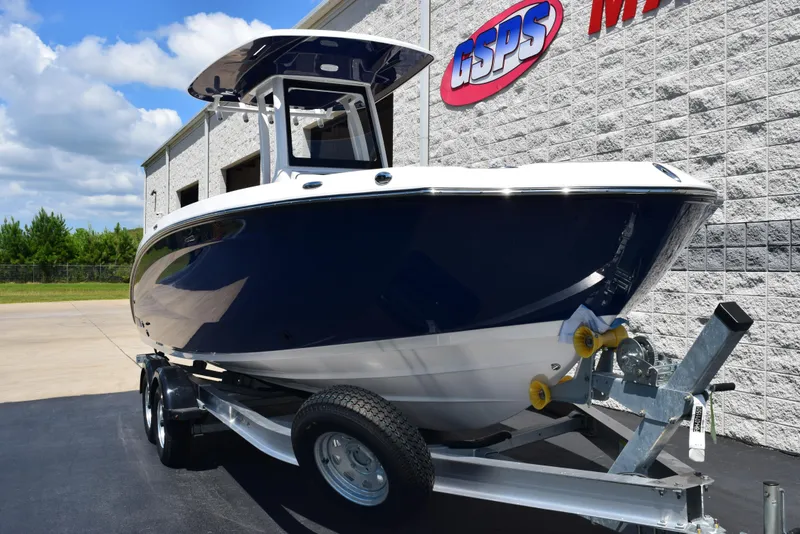 Slide: The Image of 2025 Yamaha Boats 255 FSH Sport E on trailer, parked outside dealership. - 2