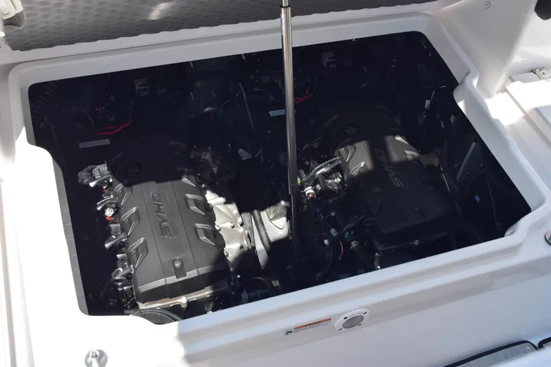 Slide: The Image of 2025 Yamaha Boats 255 FSH Sport E engine compartment with dual engines. - 25