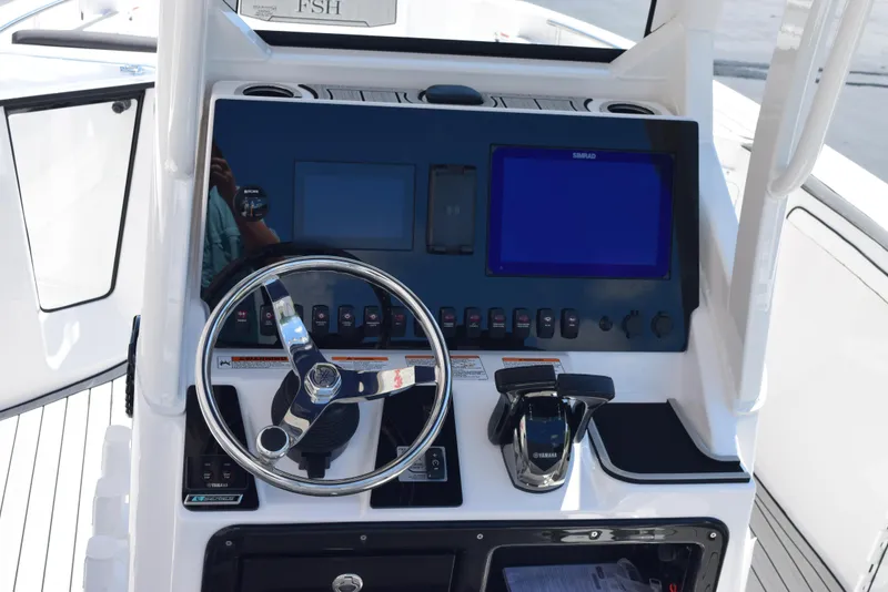 Slide: The Image of Yamaha Boats 2025 255 FSH Sport E dashboard with steering wheel and digital displays. - 8