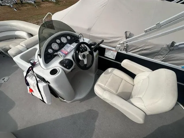 Slide: The Image of 2015 Starcraft Stardeck 206 Cruise-N-Fish boat interior with steering console and seating. - 3