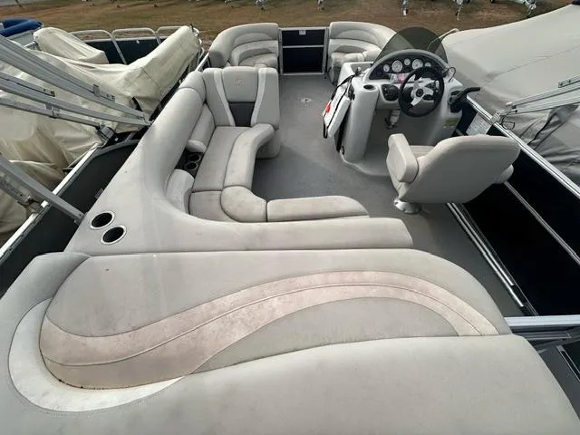 Slide: The Image of 2015 Starcraft Stardeck 206 Cruise-N-Fish boat interior with plush seating and steering console. - 5