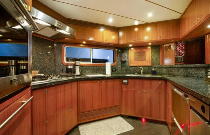 Slide: The Image of Luxurious kitchen interior of 2009 Nordhavn 76 yacht with wood cabinetry and granite countertops. - 10