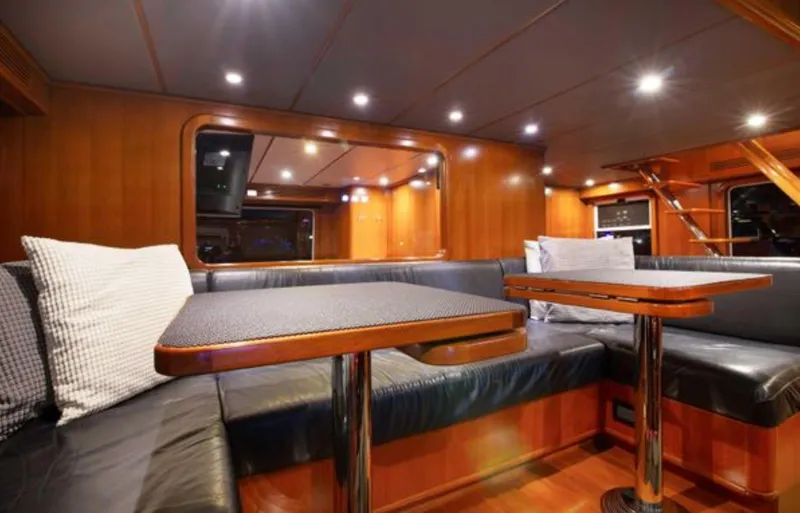 Slide: The Image of Luxurious interior of 2009 Nordhavn 76 yacht with elegant wood finish and cozy seating. - 12