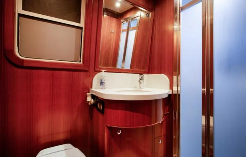 Slide: The Image of Luxurious bathroom interior of 2009 Nordhavn 76 yacht with wooden finish and modern fixtures. - 15