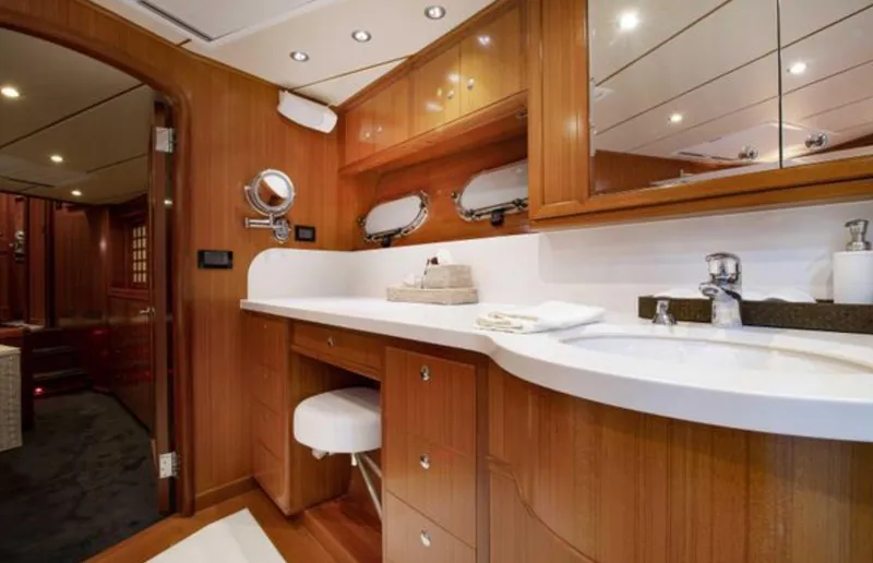 Slide: The Image of Luxurious bathroom in 2009 Nordhavn 76 yacht with wooden cabinetry and modern fixtures. - 19