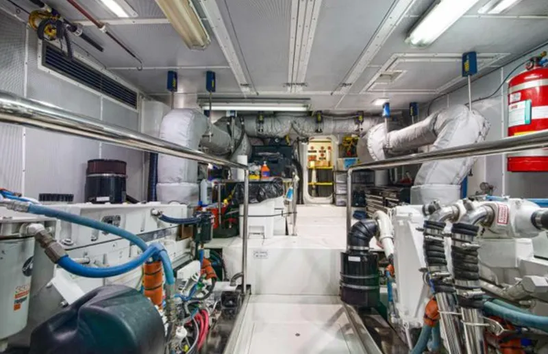 Slide: The Image of Engine room of 2009 Nordhavn 76 yacht, featuring complex machinery and equipment. - 20