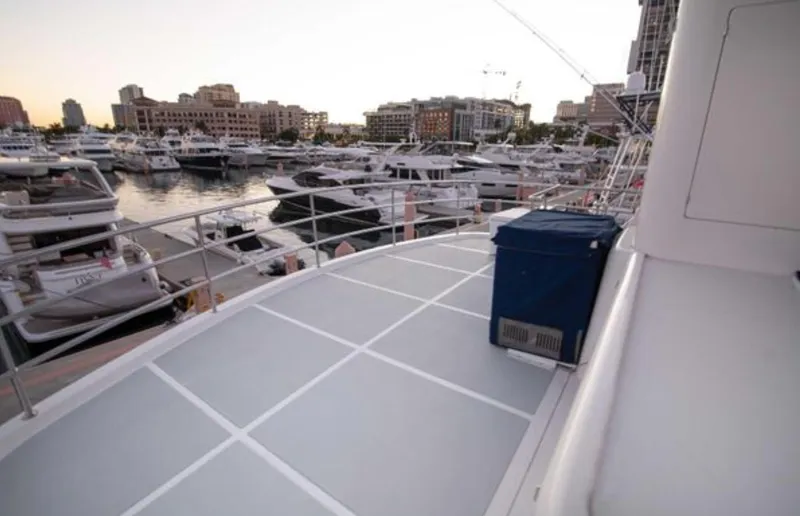 Slide: The Image of Nordhavn 76 yacht deck overlooking marina with multiple boats, 2009 model. - 6