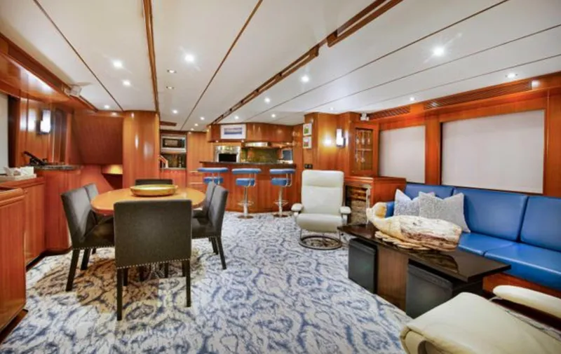 Slide: The Image of Luxurious interior of 2009 Nordhavn 76 yacht with elegant seating and dining area. - 7