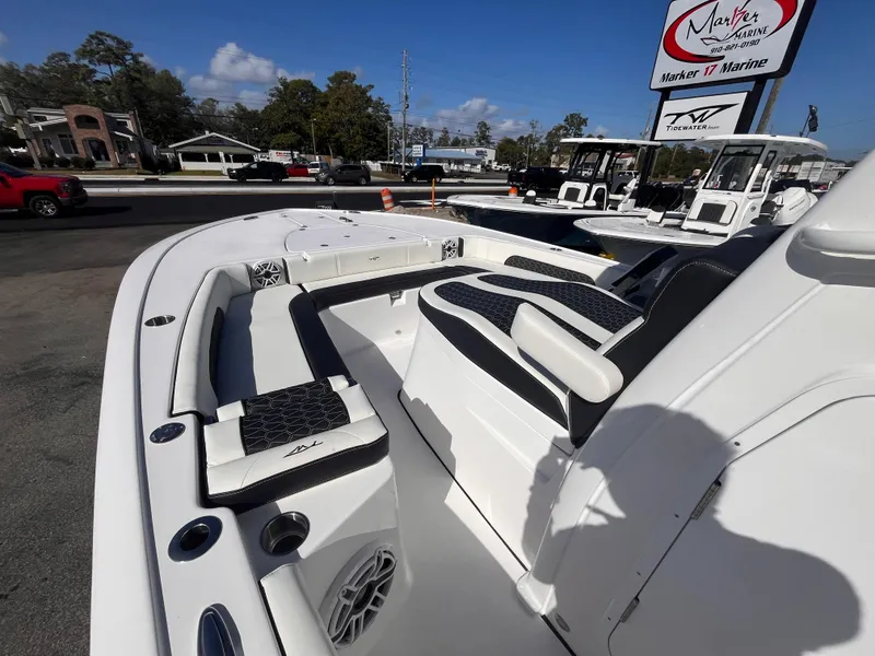 Slide: The Image of 2025 Tidewater 3100 Carolina Bay boat interior with seating and speaker system. - 15