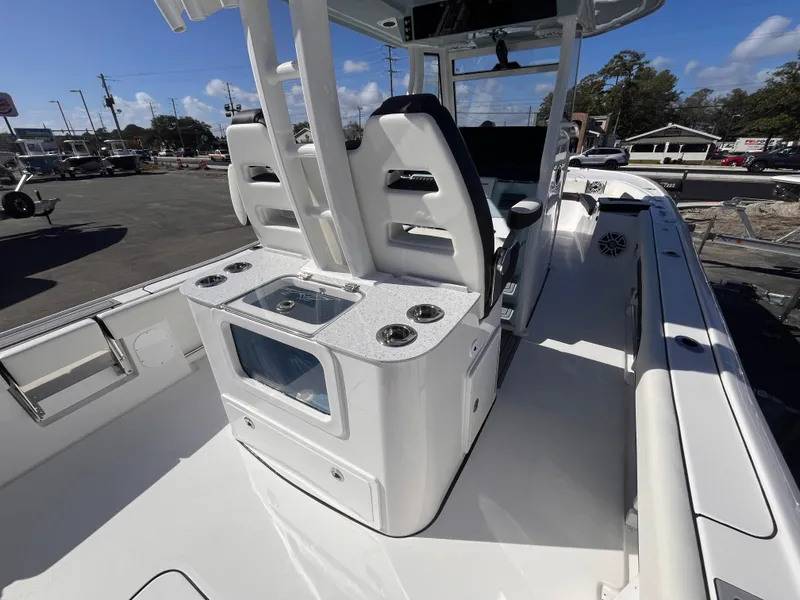 Slide: The Image of 2025 Tidewater 3100 Carolina Bay boat interior with seating and storage compartments. - 8