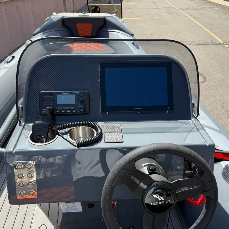 Slide: The Image of 2025 Highfield Sport 520 boat on trailer in outdoor setting. - 2