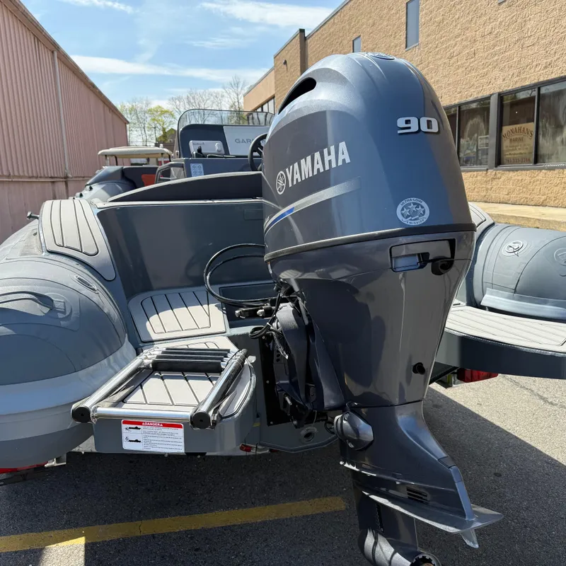 Slide: The Image of 2025 Highfield Sport 520 boat interior with orange and gray seating. - 4