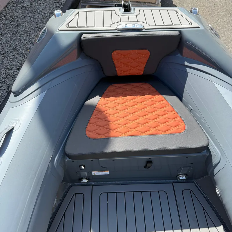 Slide: The Image of 2025 Highfield Sport 520 boat interior with orange and gray seating. - 9