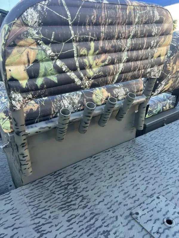 Slide: The Image of Camouflage seating and rod holders on 2025 War Eagle 961 Blackhawk boat. - 16