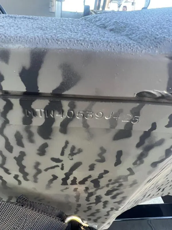 Slide: The Image of Close-up of 2025 War Eagle 961 Blackhawk with camouflage pattern and visible serial number. - 19